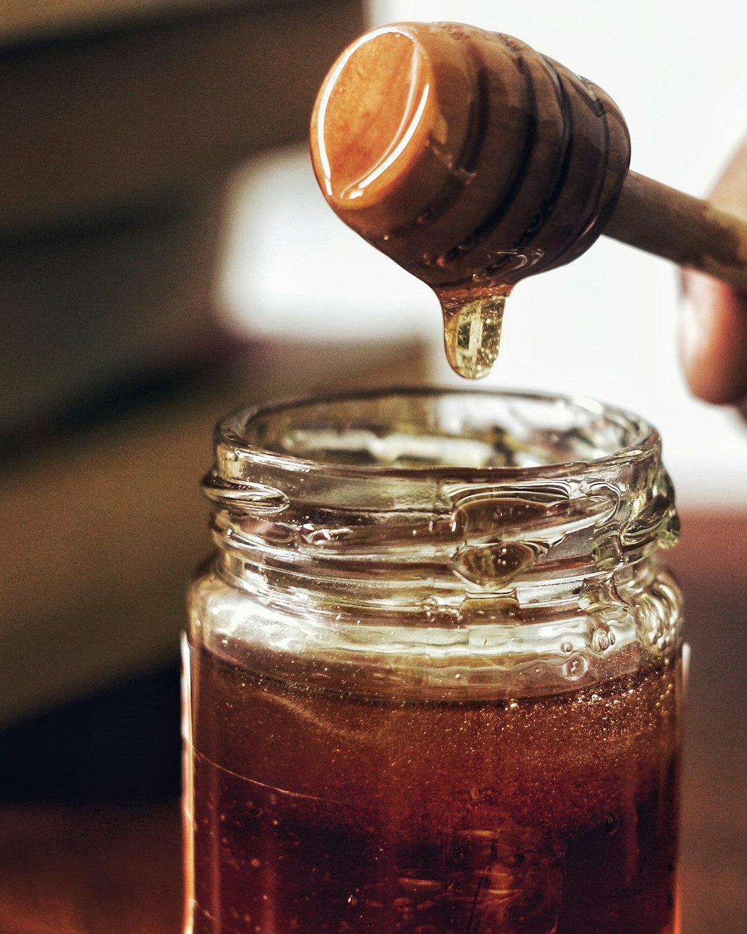 Honey jar with honeycomb — placeholder editorial photo, replace with brand shot