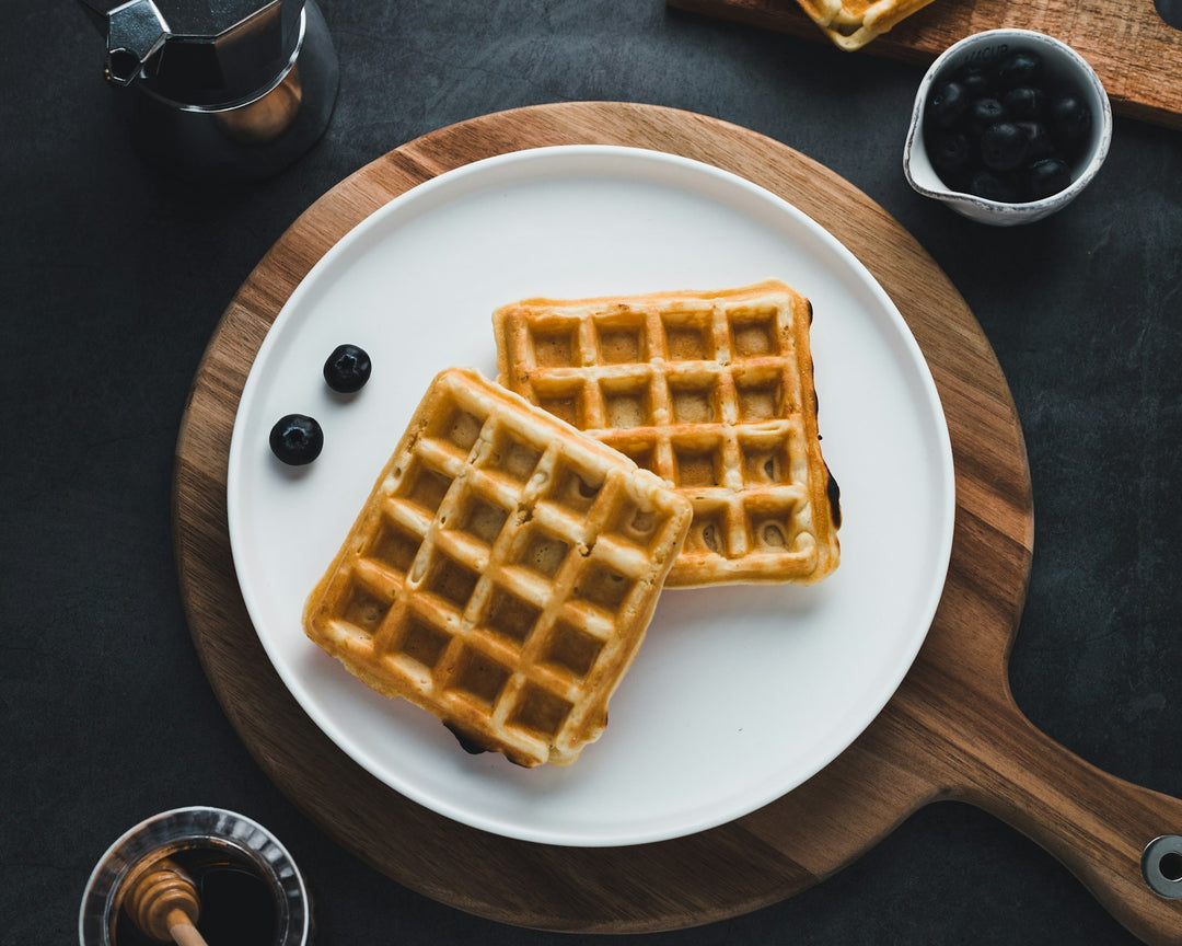 Golden waffles with honey on a plate — placeholder editorial photo, replace with brand shot