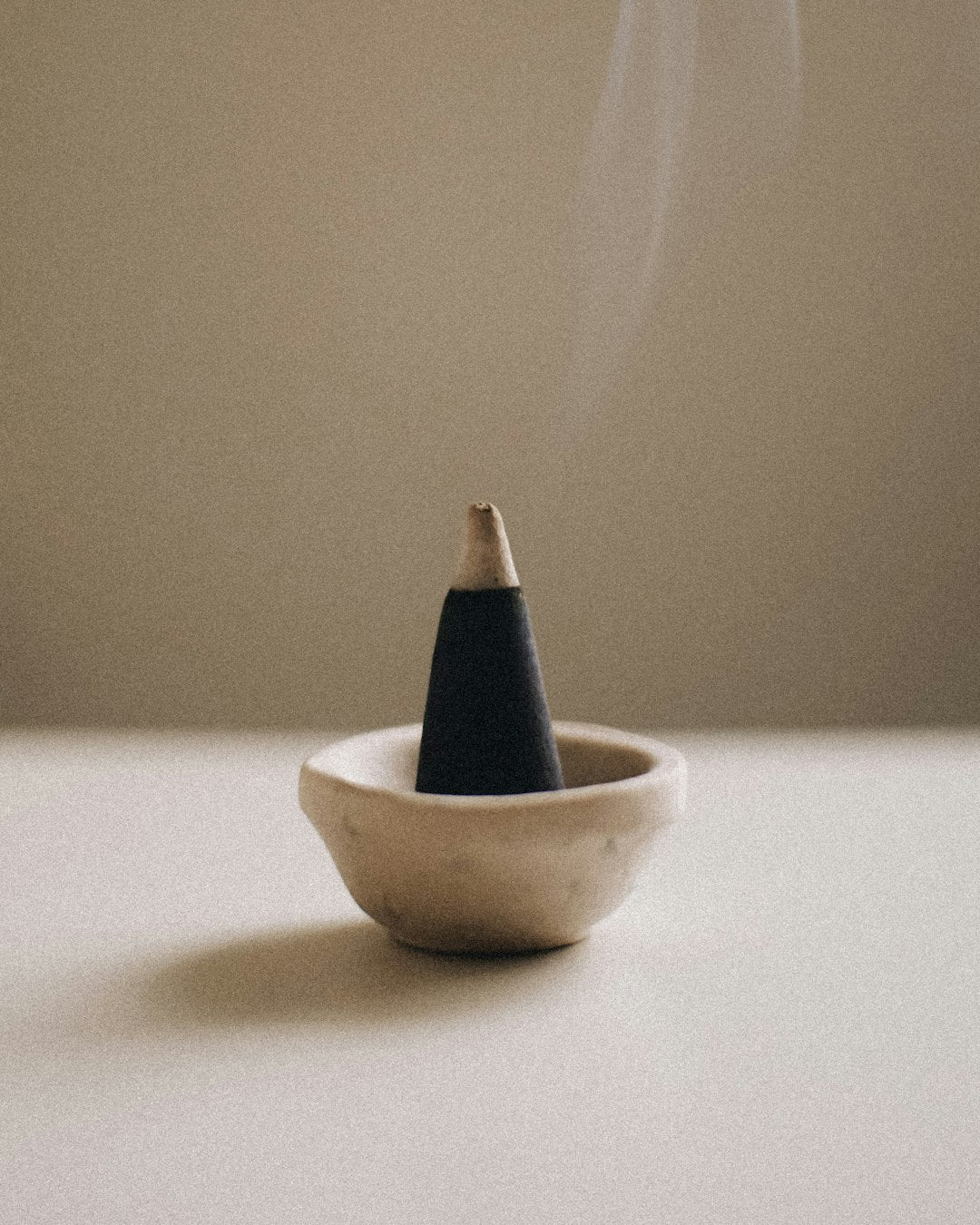 Incense smoking in a bowl burner — placeholder editorial photo, replace with brand shot